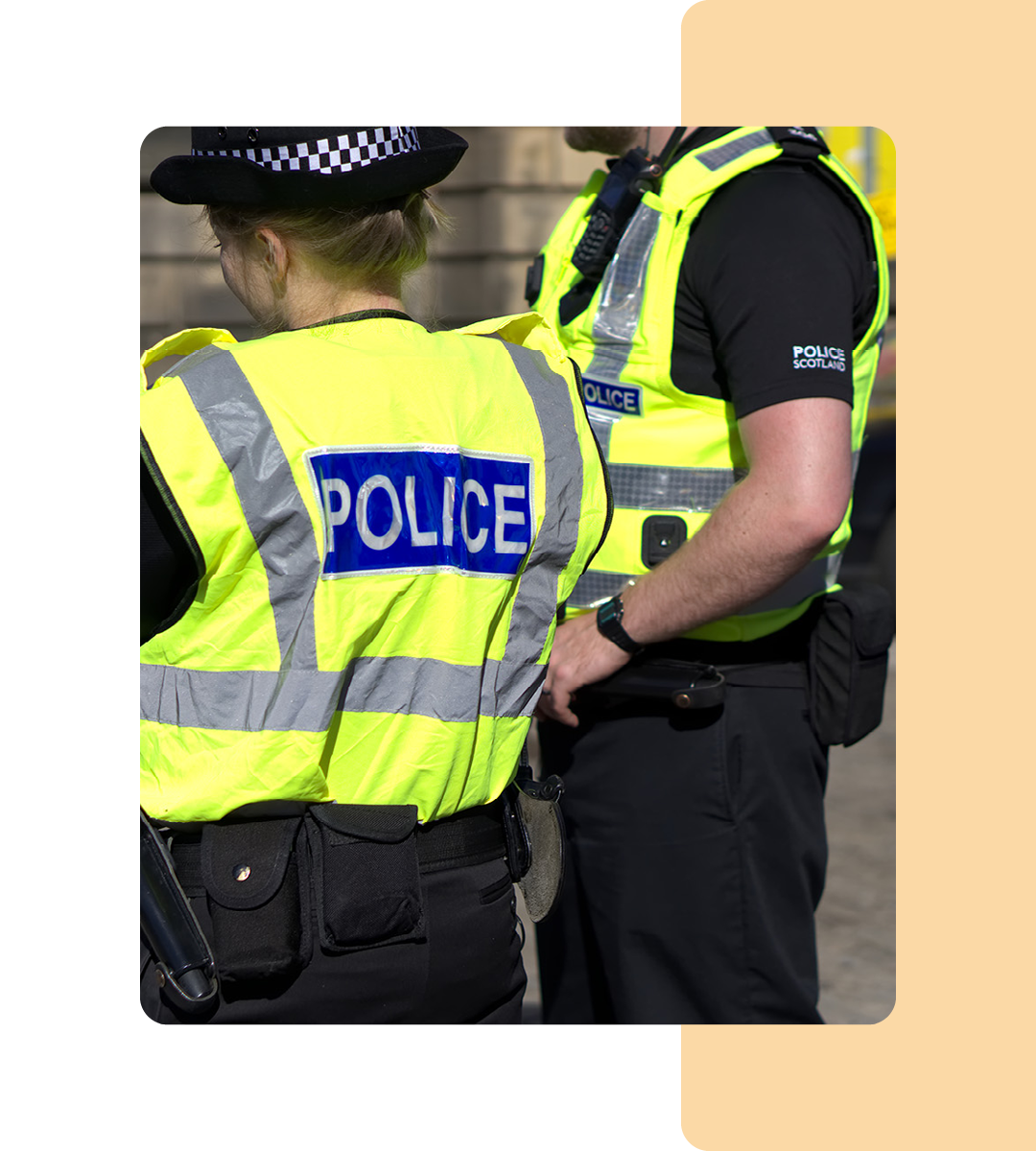 Image of two police officers stood on a street