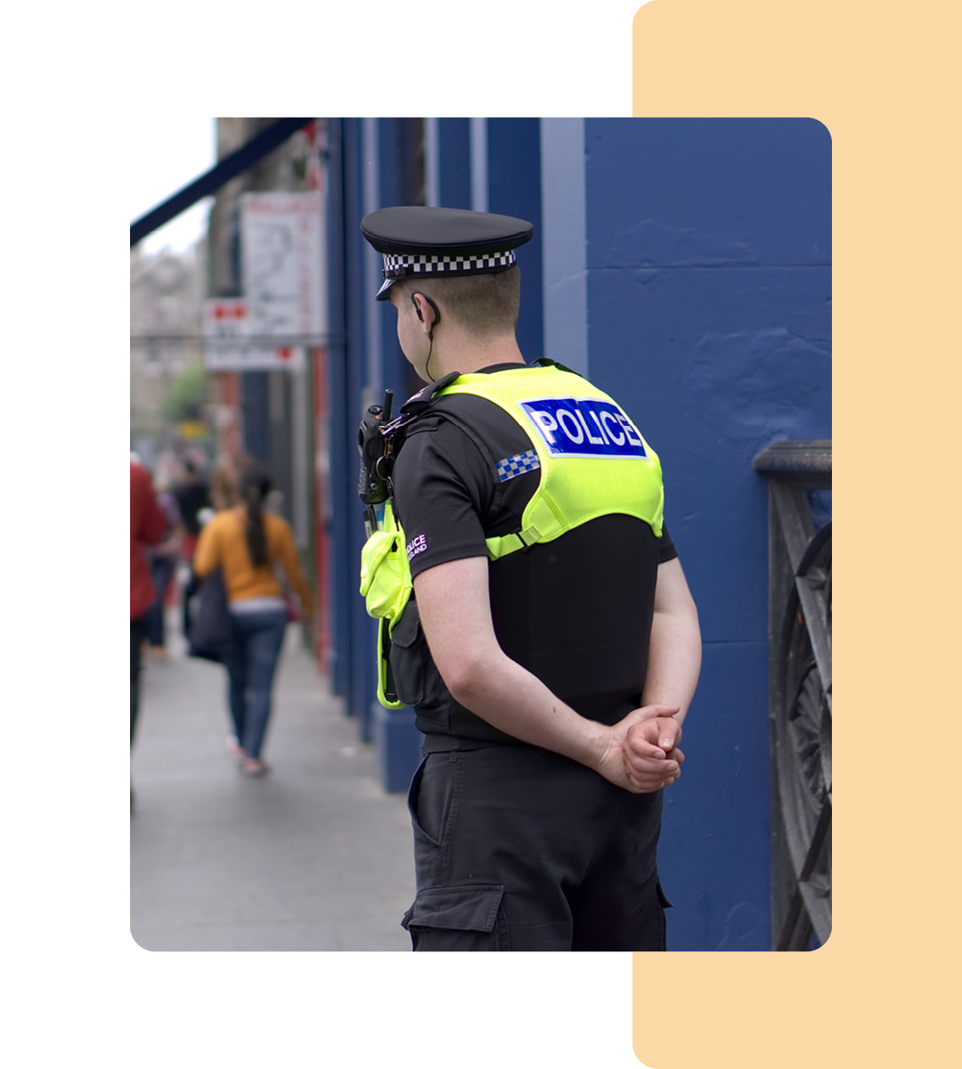 Image of a police officer stood on a street