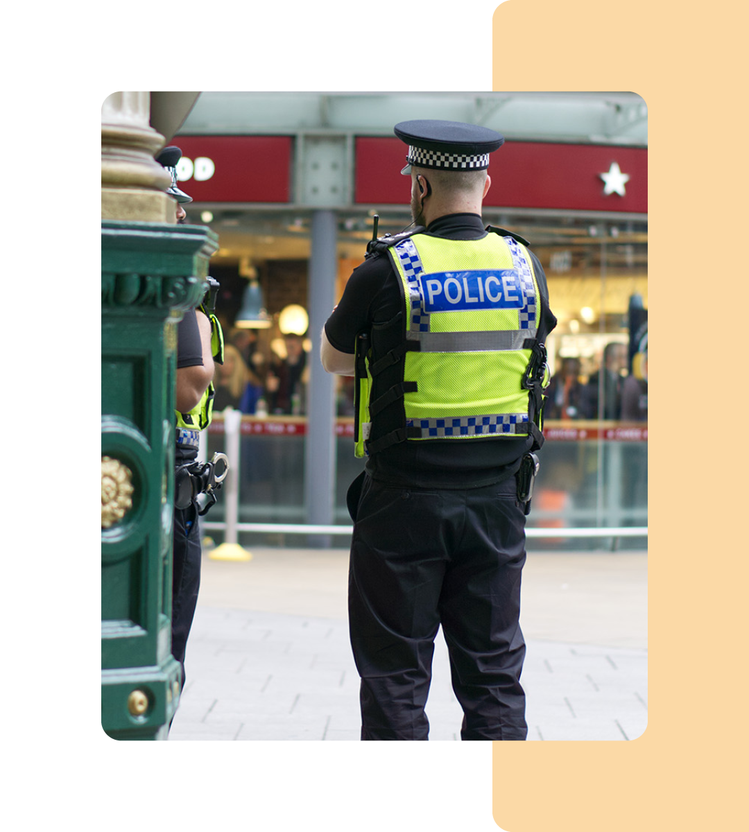 Image of a police officer stood on a street