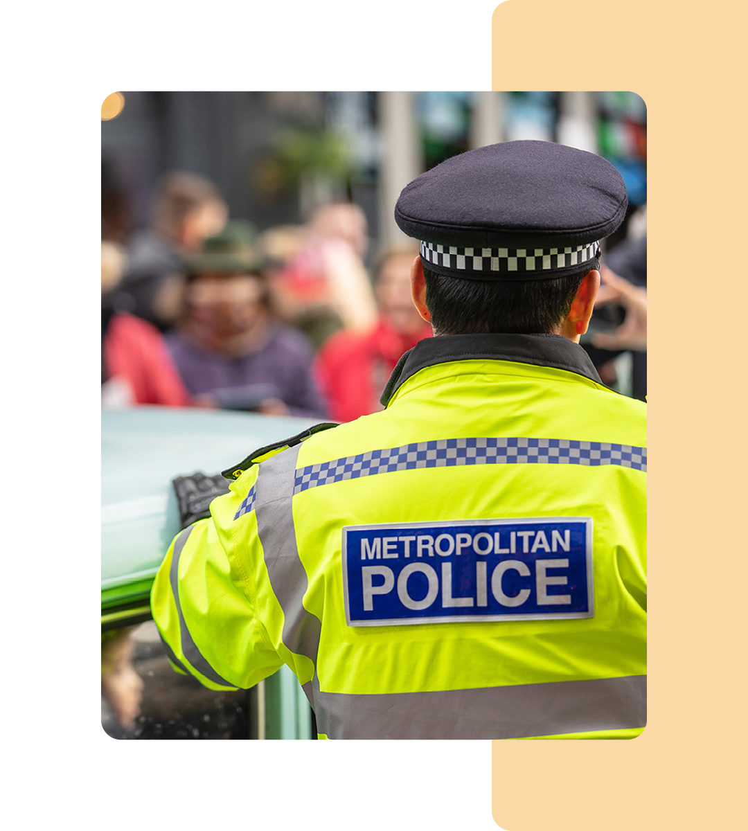 Image of a police officer stood on a street