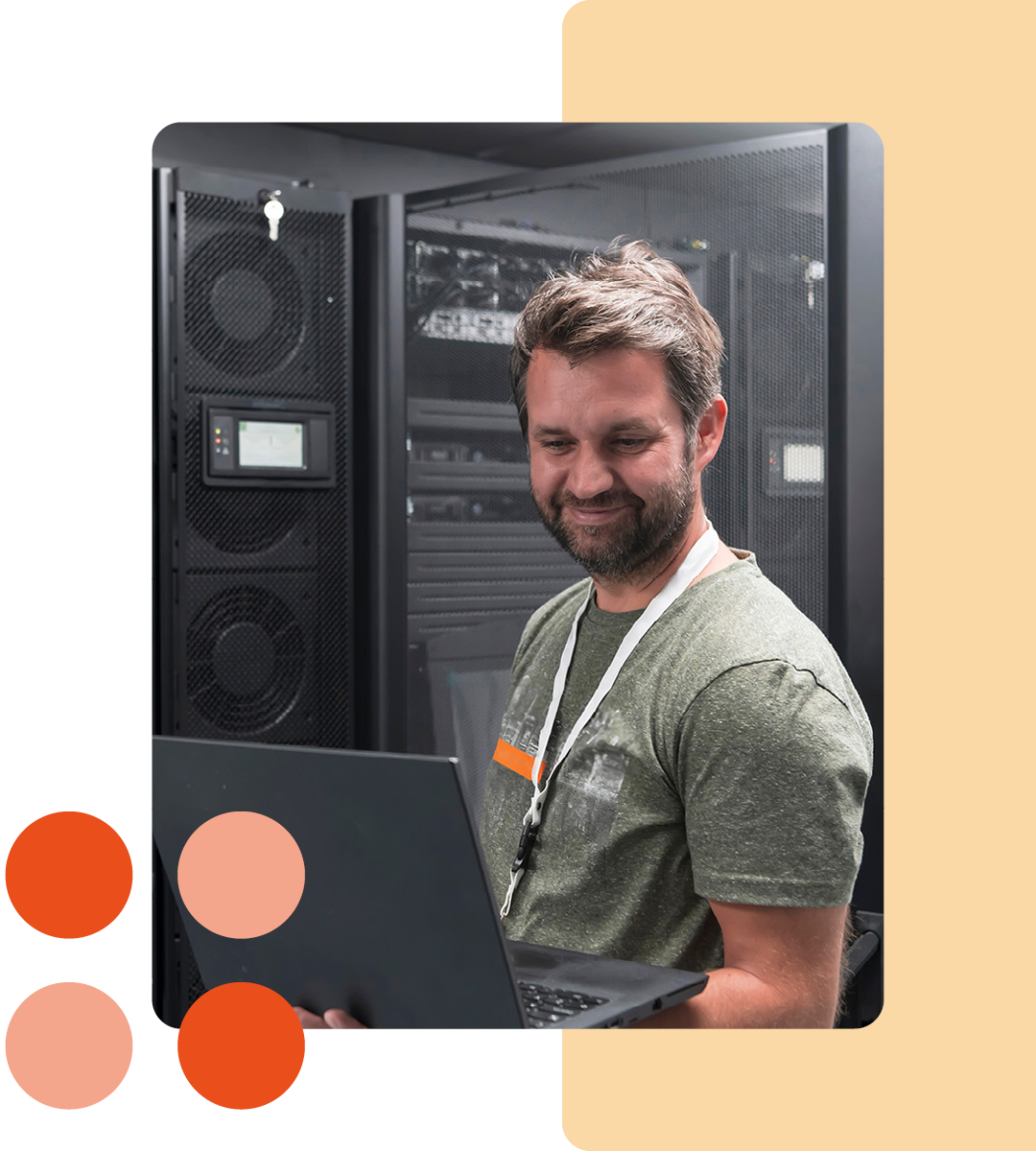 Image of an IT professional working on a laptop in a server room