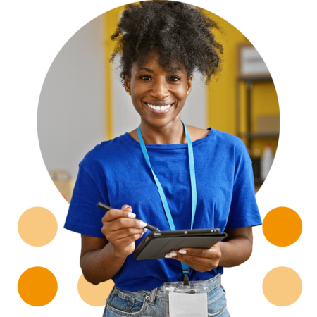 Image of a smiling charity volunteer holding a tablet