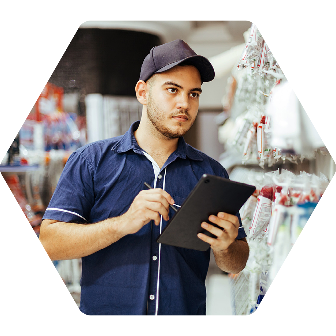 Image of a retail worker doing a stock check with a tablet