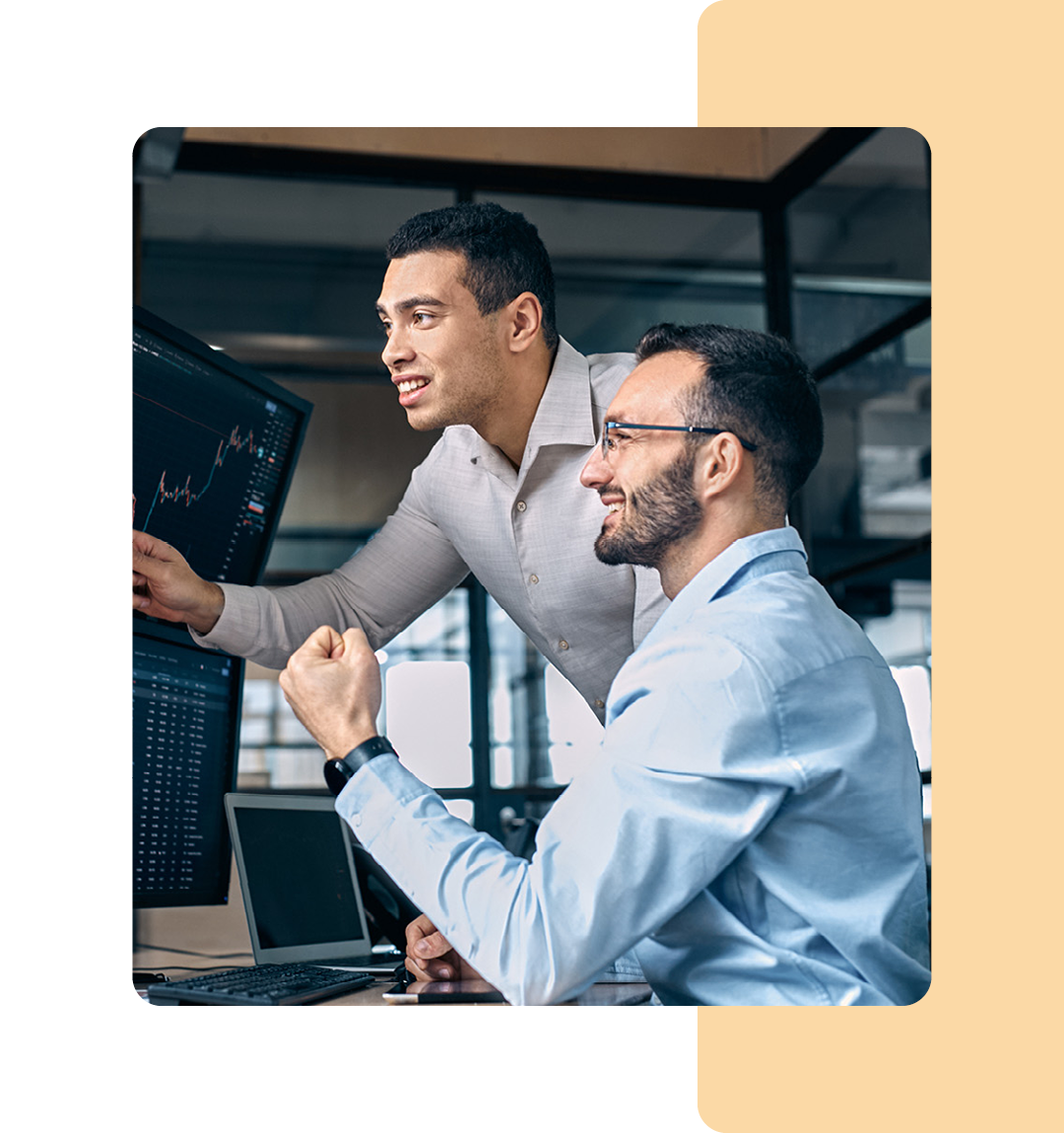 Image of two colleagues working on a computer together