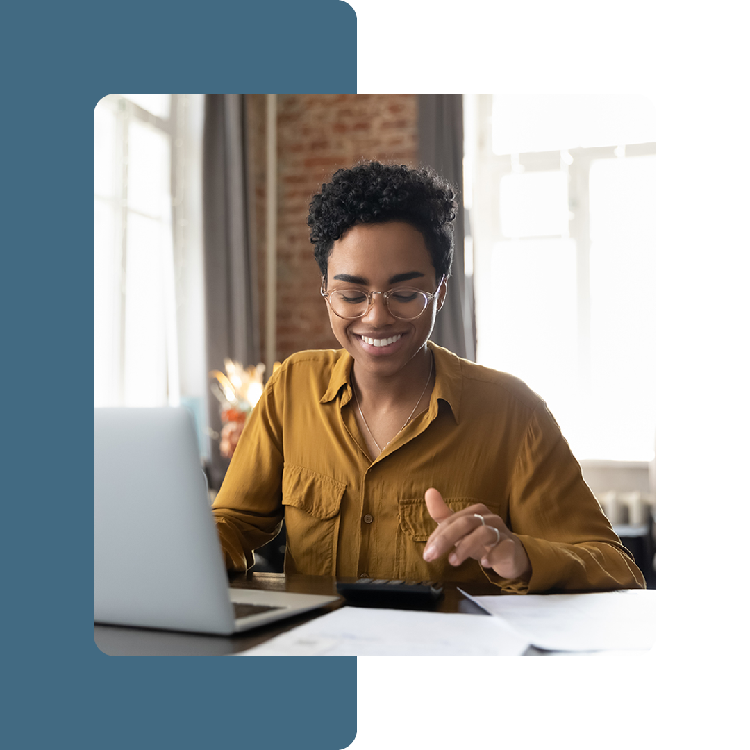 Image of a smiling remote worker on a laptop