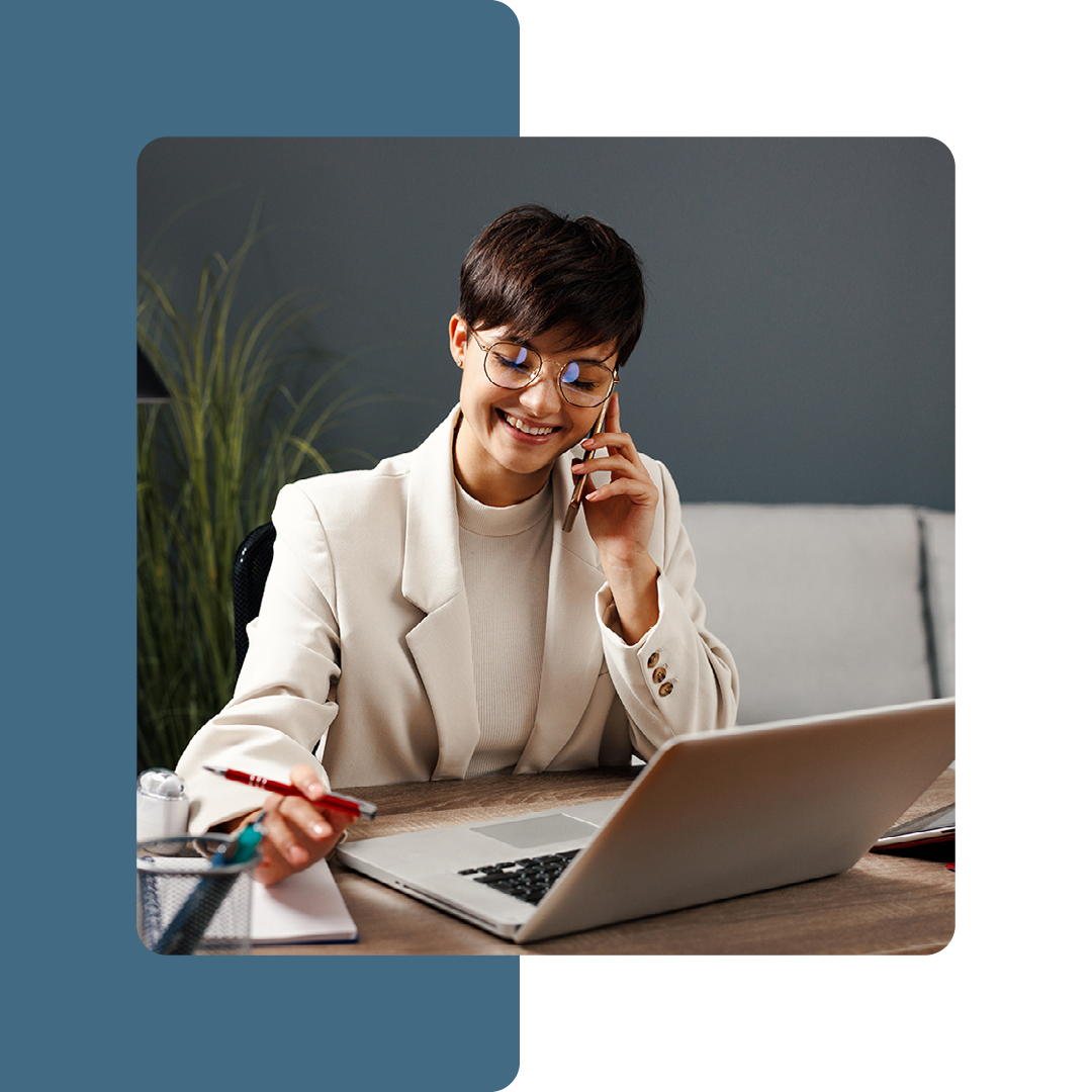 Image of a smiling remote worker on a laptop