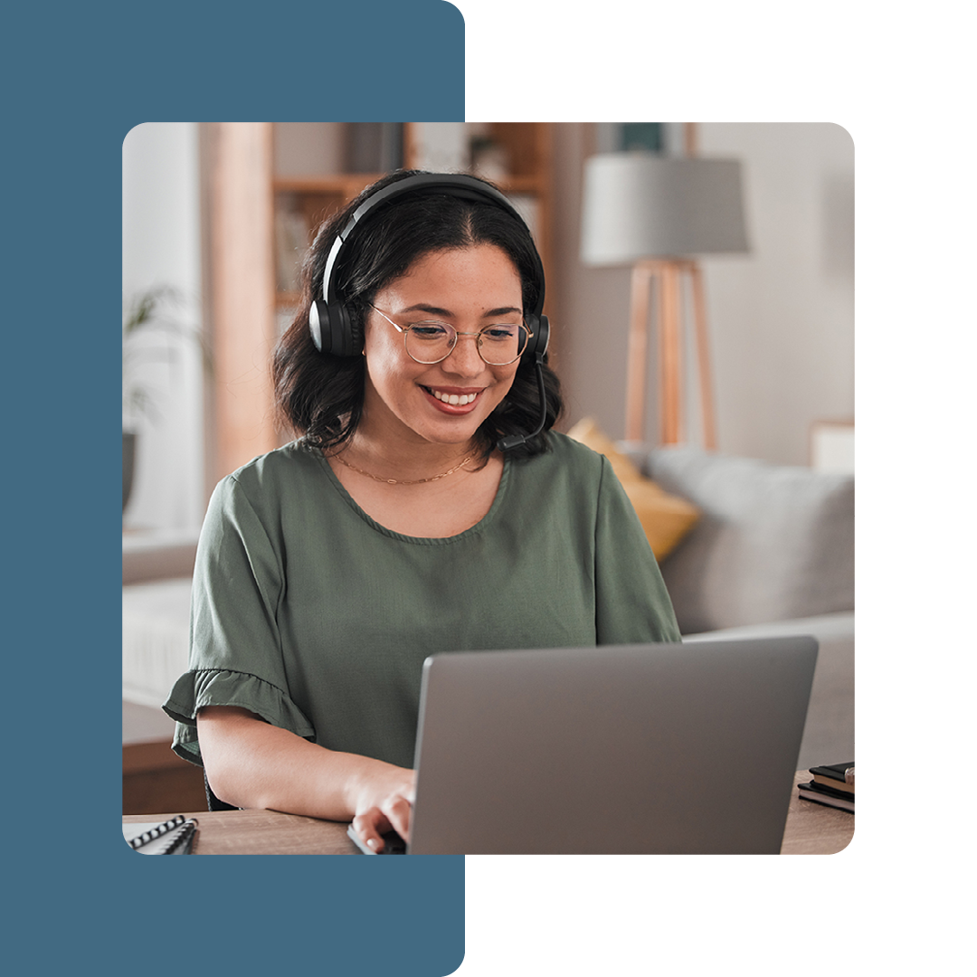 Image of a smiling remote worker on a laptop