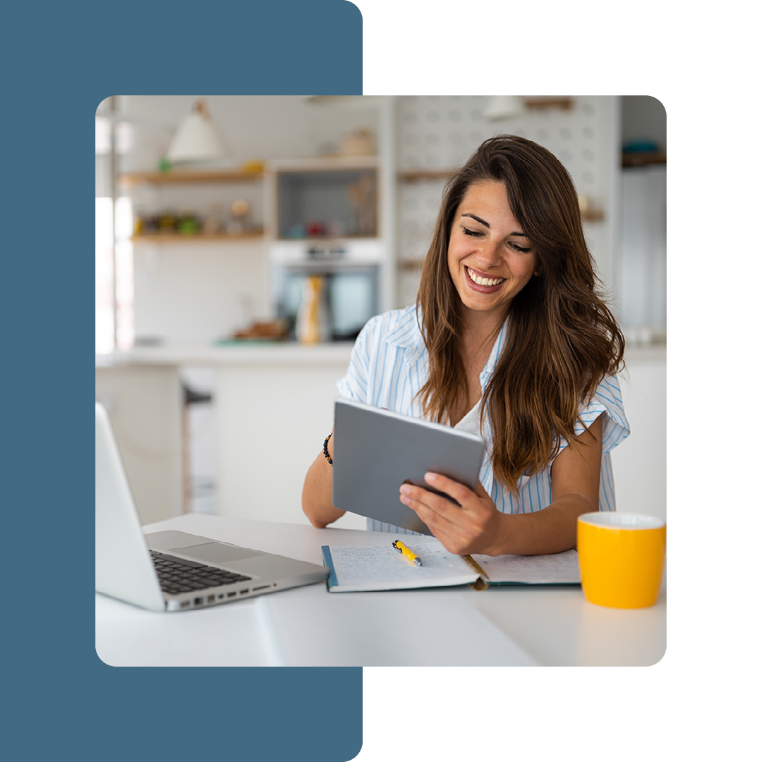 Image of a smiling remote worker on a laptop