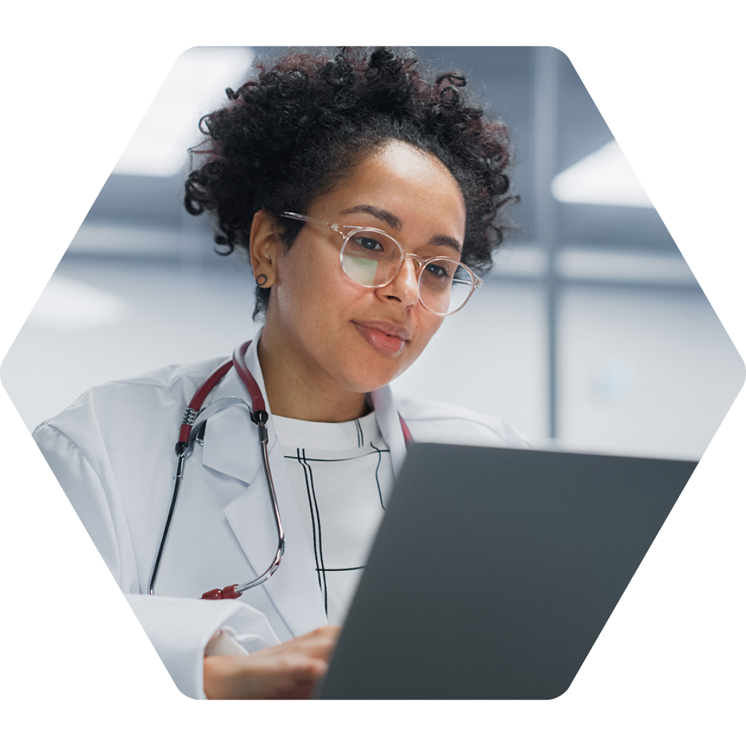 Image of a doctor working on a laptop