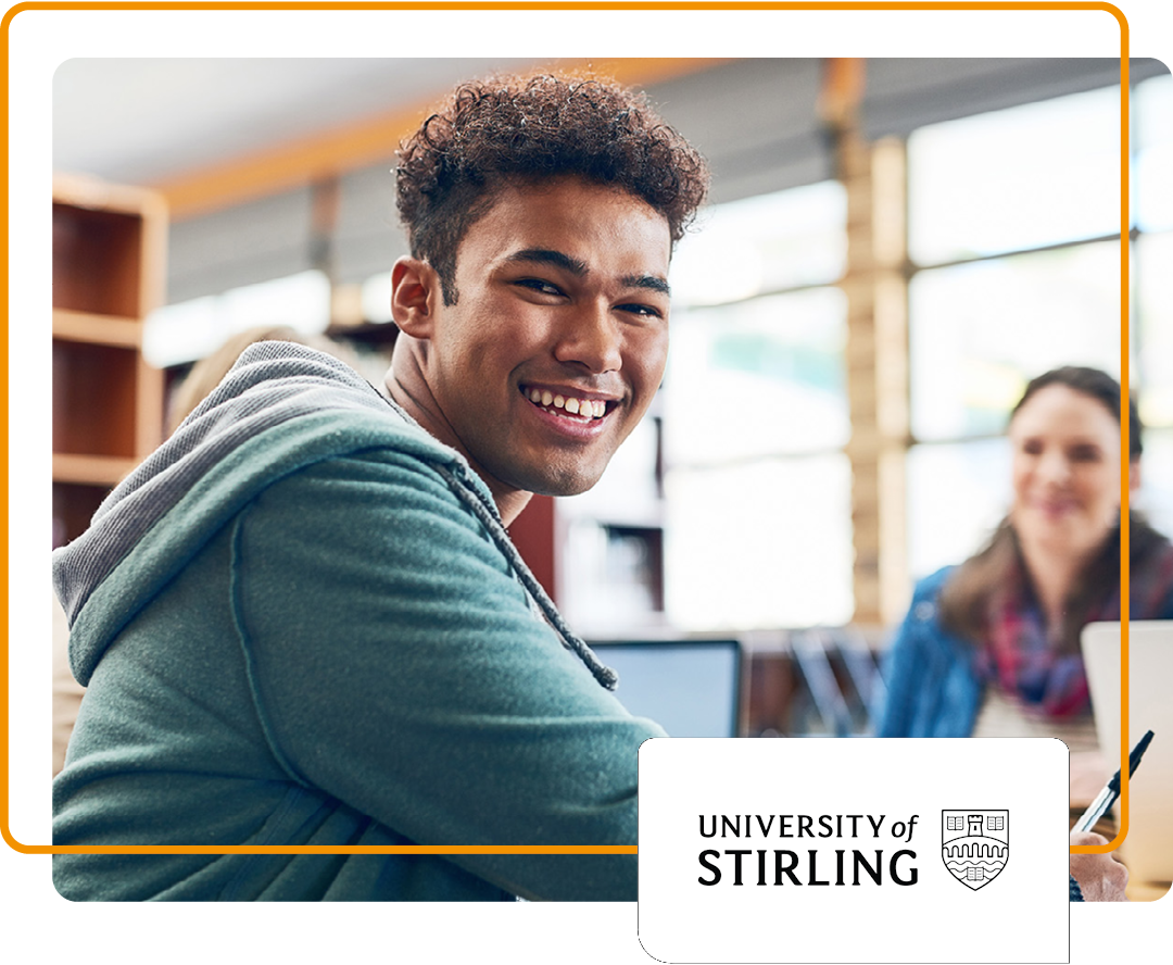 Image of a smiling university student sat in a library with the University of Stirling logo