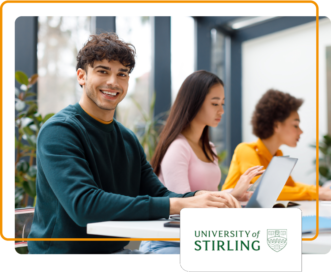 Image of a smiling student working on a laptop with the University of Stirling logo. Other students in the background