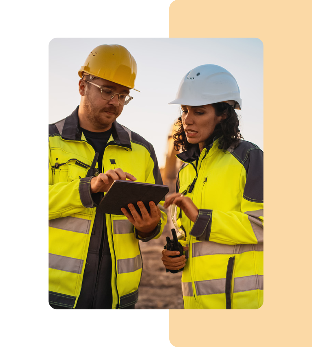 Image of two mining professionals working on a tablet