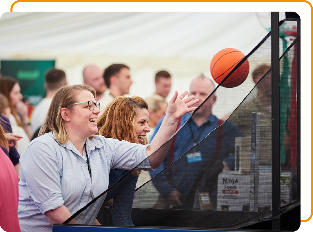 Image of Phoenix Software employees playing basketball at a employee event