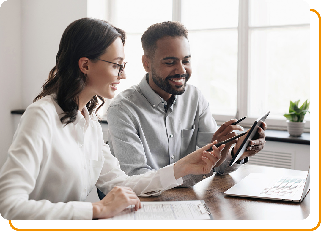 Image of two business colleagues working together on a laptop