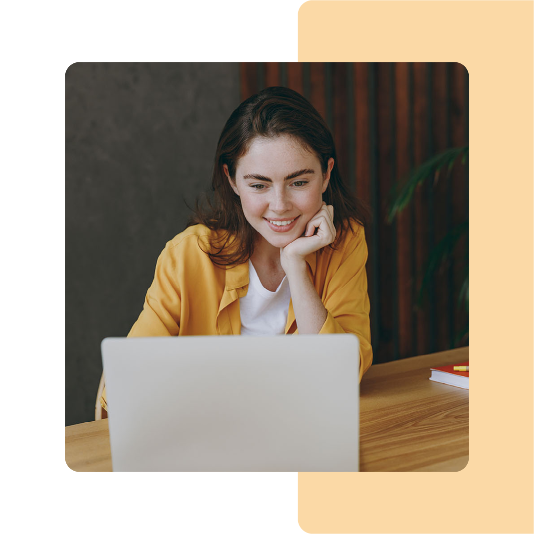 Image of a person working on a laptop