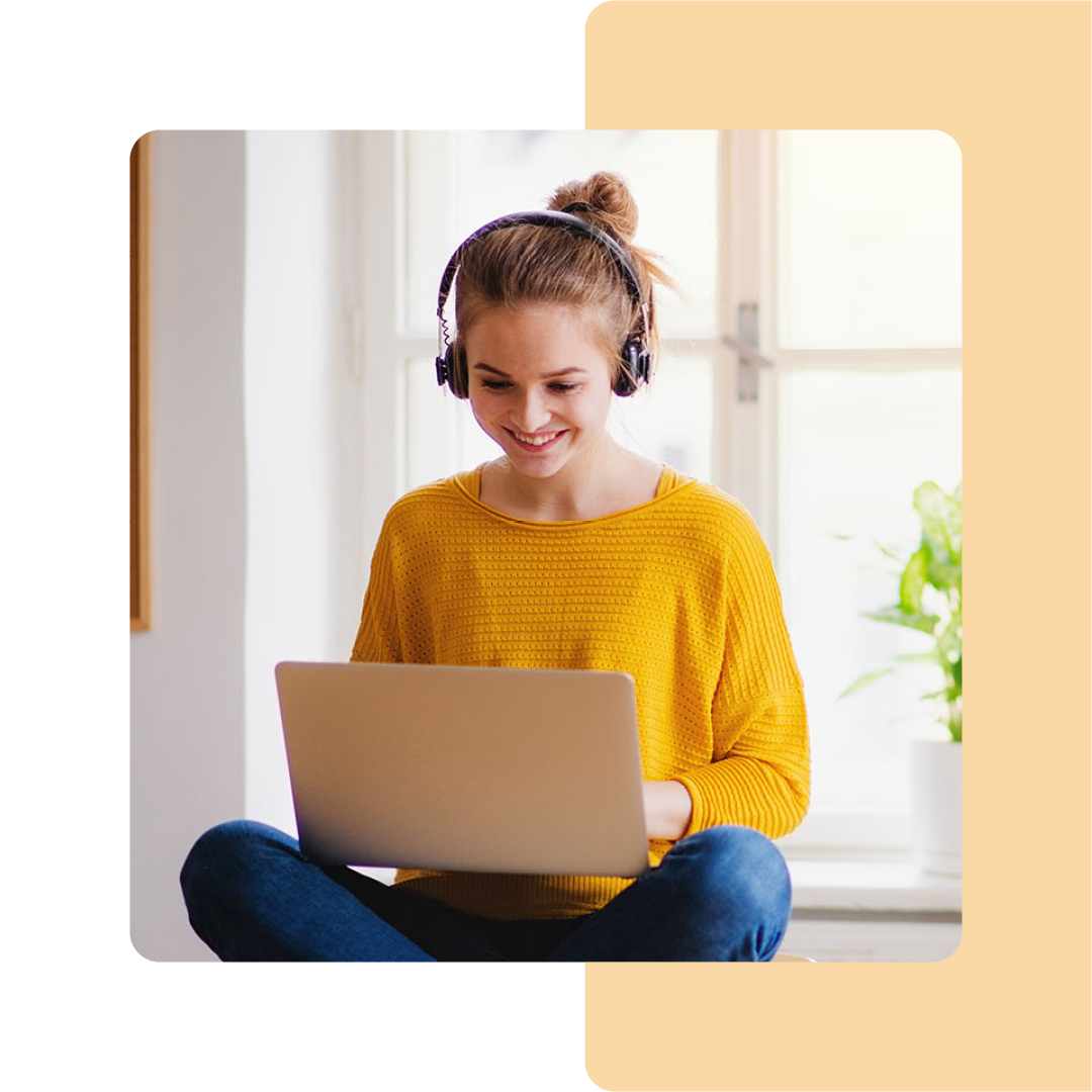 Image of a student working on a laptop at home