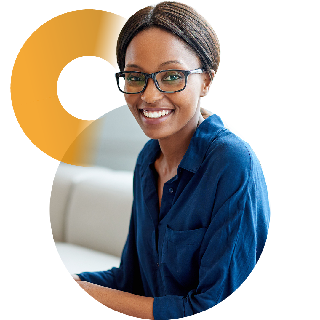 Image of a smiling business professional working on a laptop