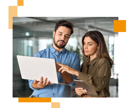 Image of a two business professionals working on a laptop