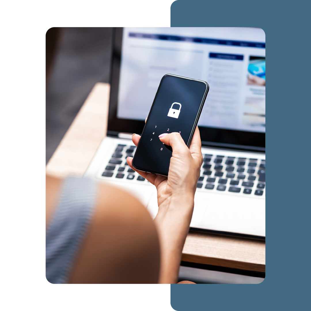 Image of a person holding a mobile phone with a padlock on the screen