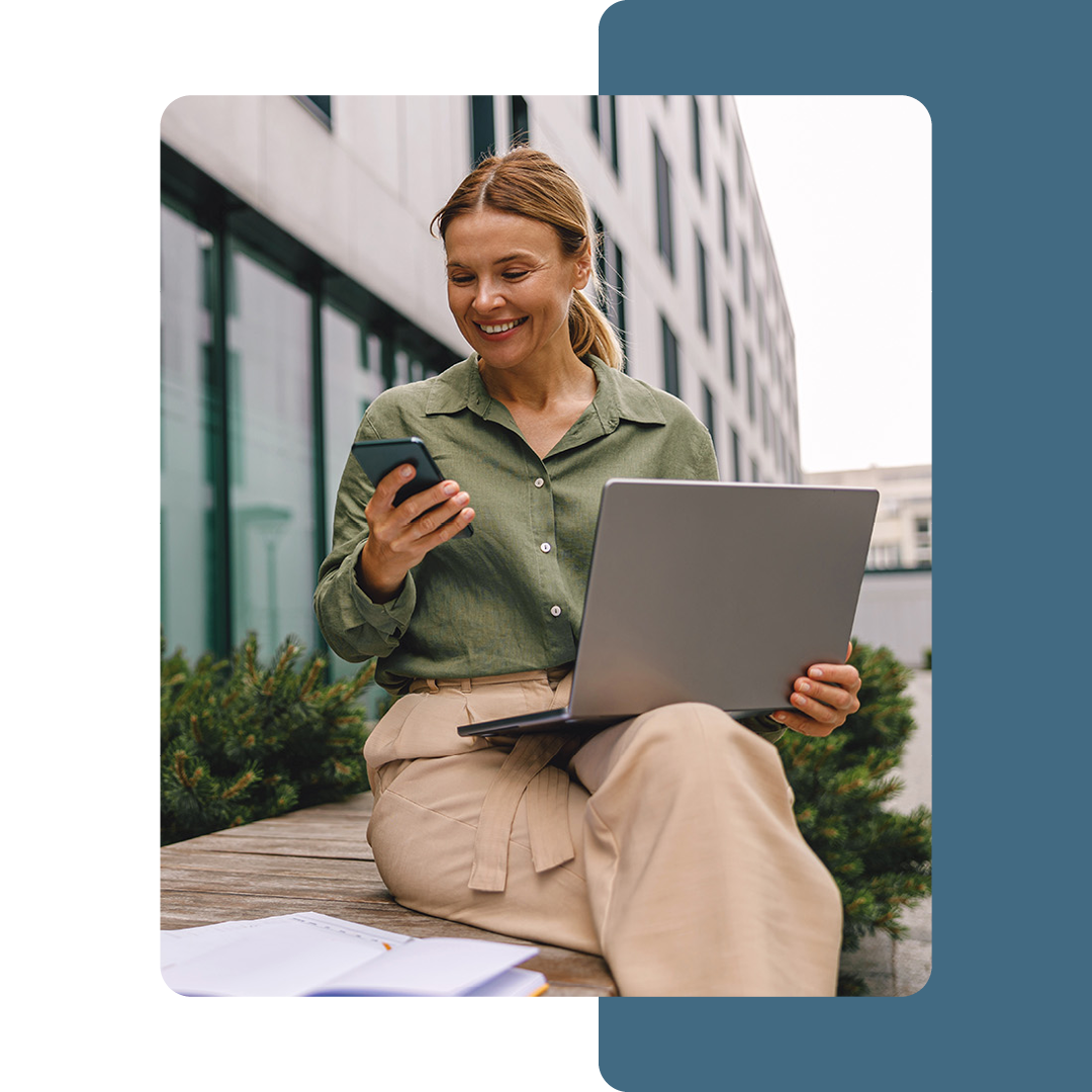 Image of a person working remotely outside on a laptop