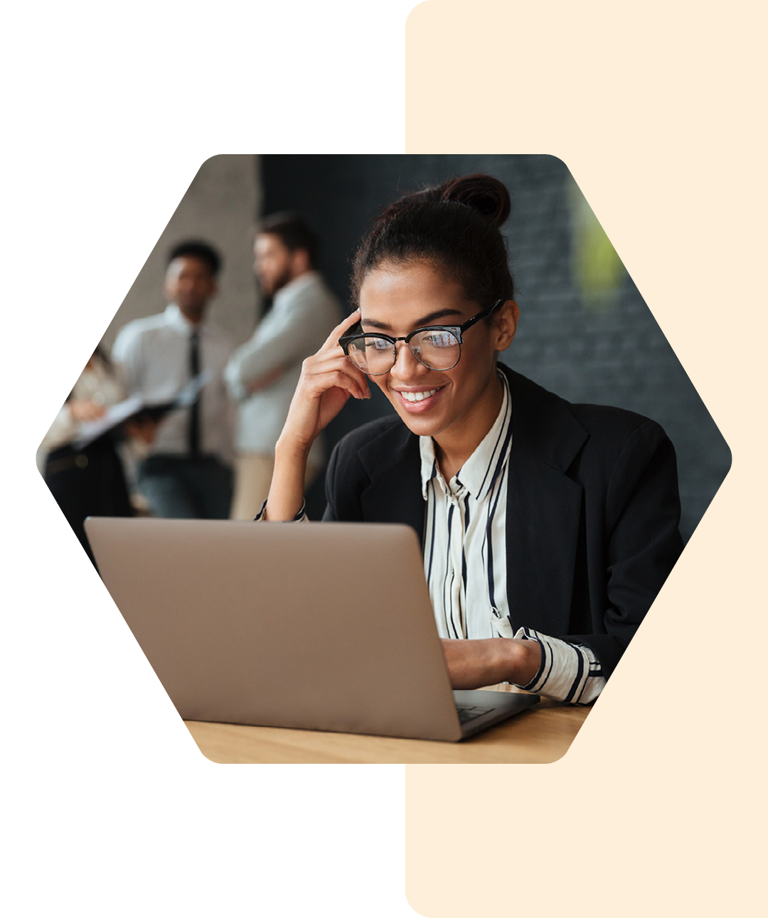 Image of a smiling business professional working on a laptop