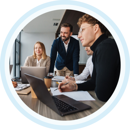 Image of a group of colleagues collaborating in a room together