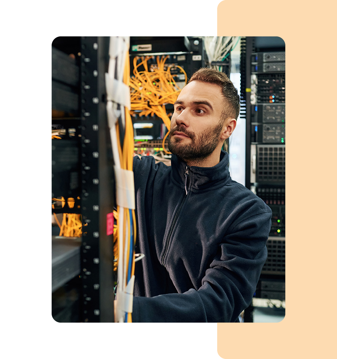 Image of an IT professional working in a data storage room