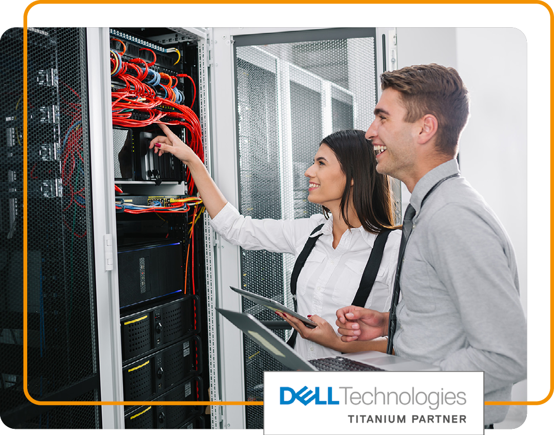 Image of two IT professionals working in a data storage room with our Dell Technologies Titanium Partner logo