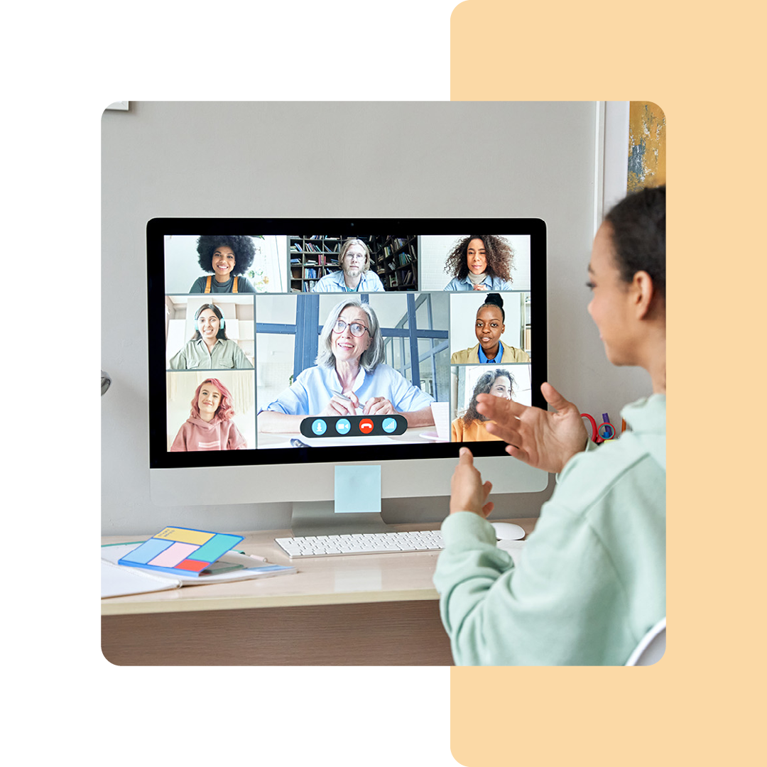 Image of a person on a virtual meeting on their desktop and monitor