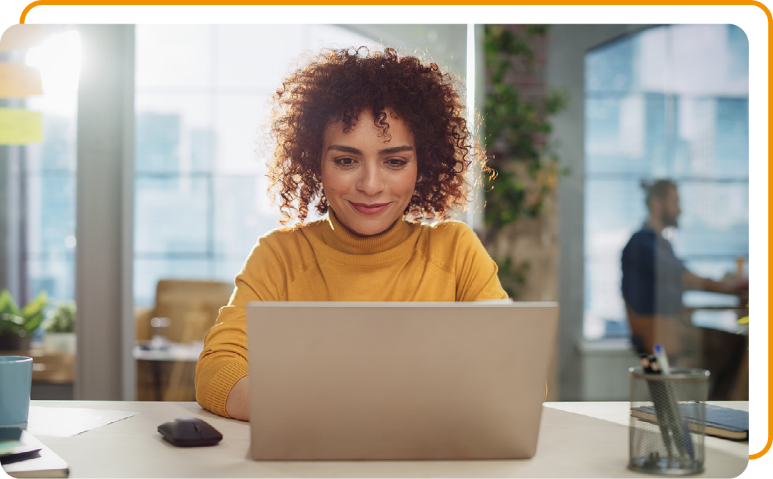 Image of a person working on a laptop