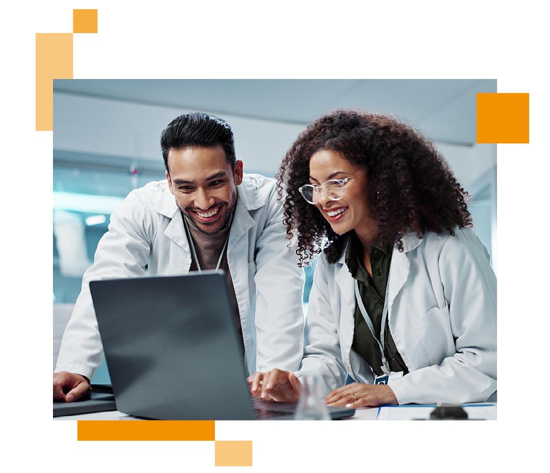 Image of two doctors looking at information on a laptop