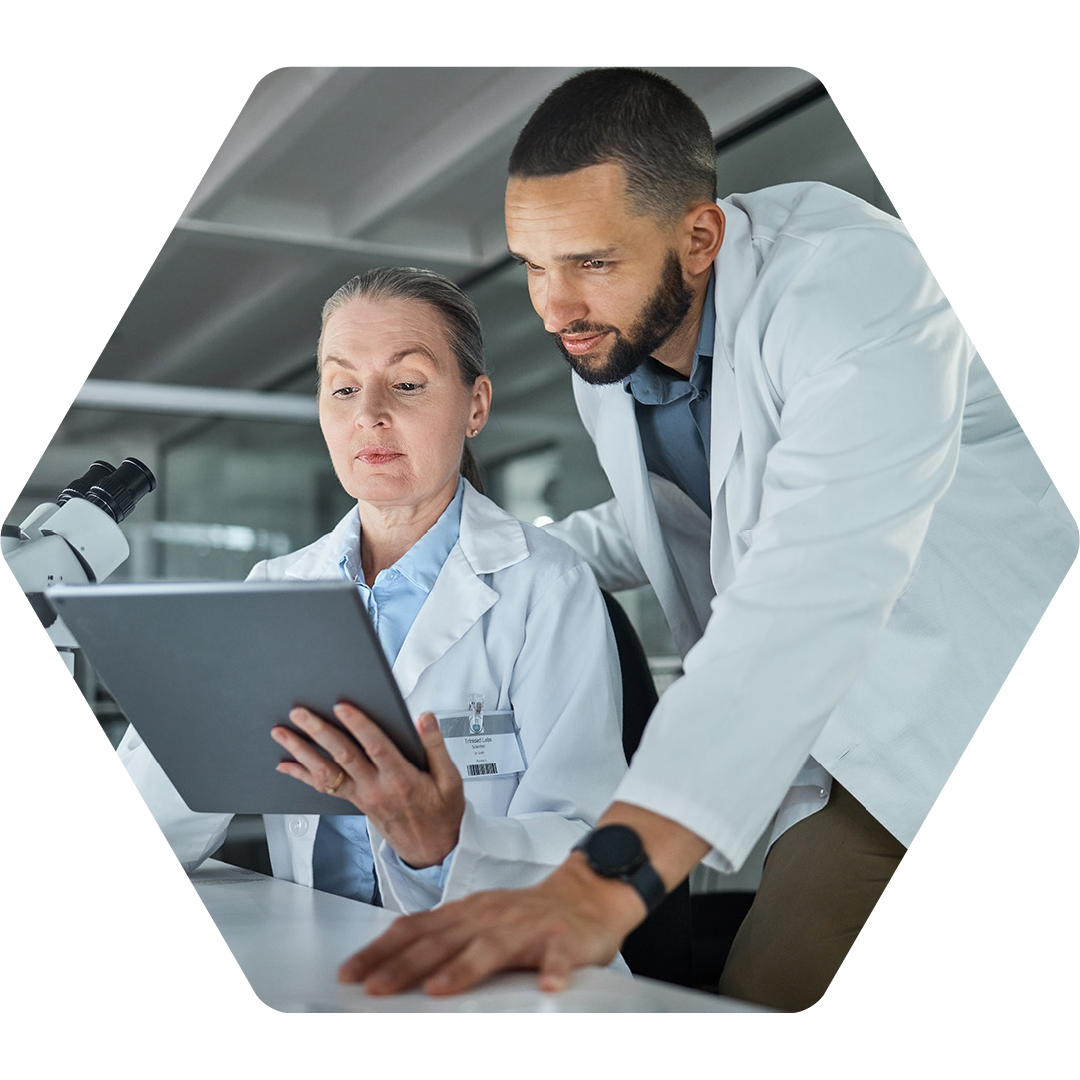 Image of two doctors looking at information on a tablet