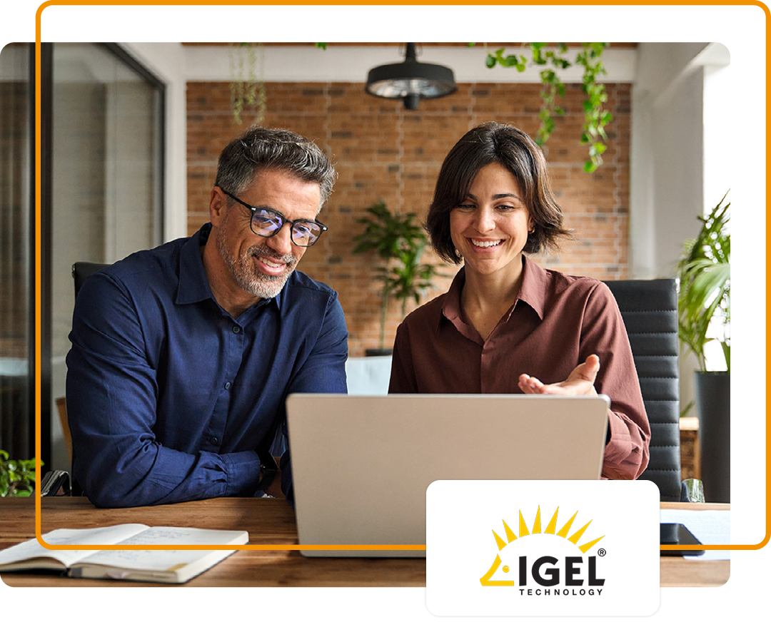 Image of two colleagues working together on a laptop in the office