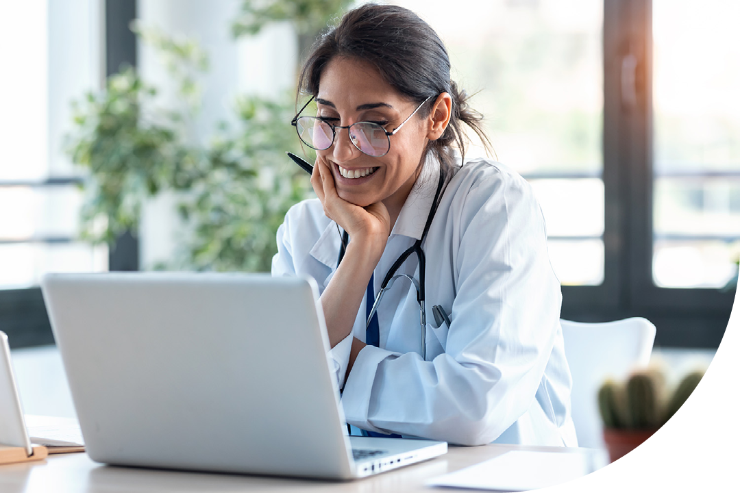 Image of a doctor talking on a virtual call on a laptop