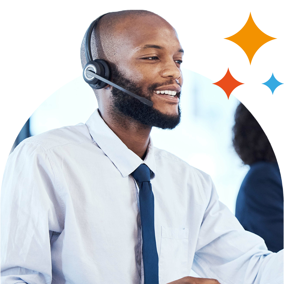 Image of an IT support professional talking on a headset in an office