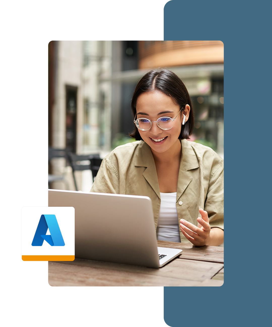 Image of a smiling working professional working on a laptop