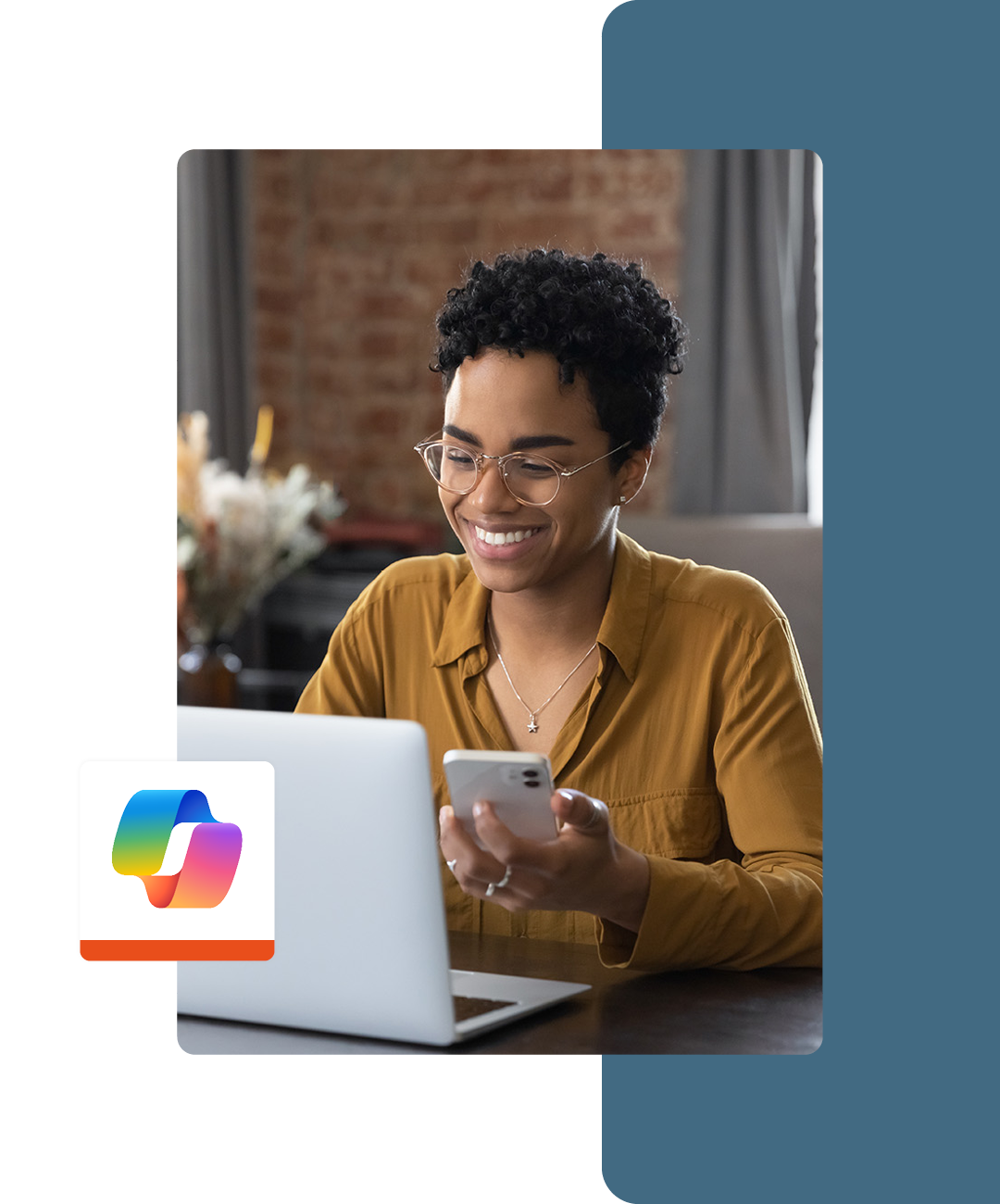 Image of a smiling working professional working on a laptop