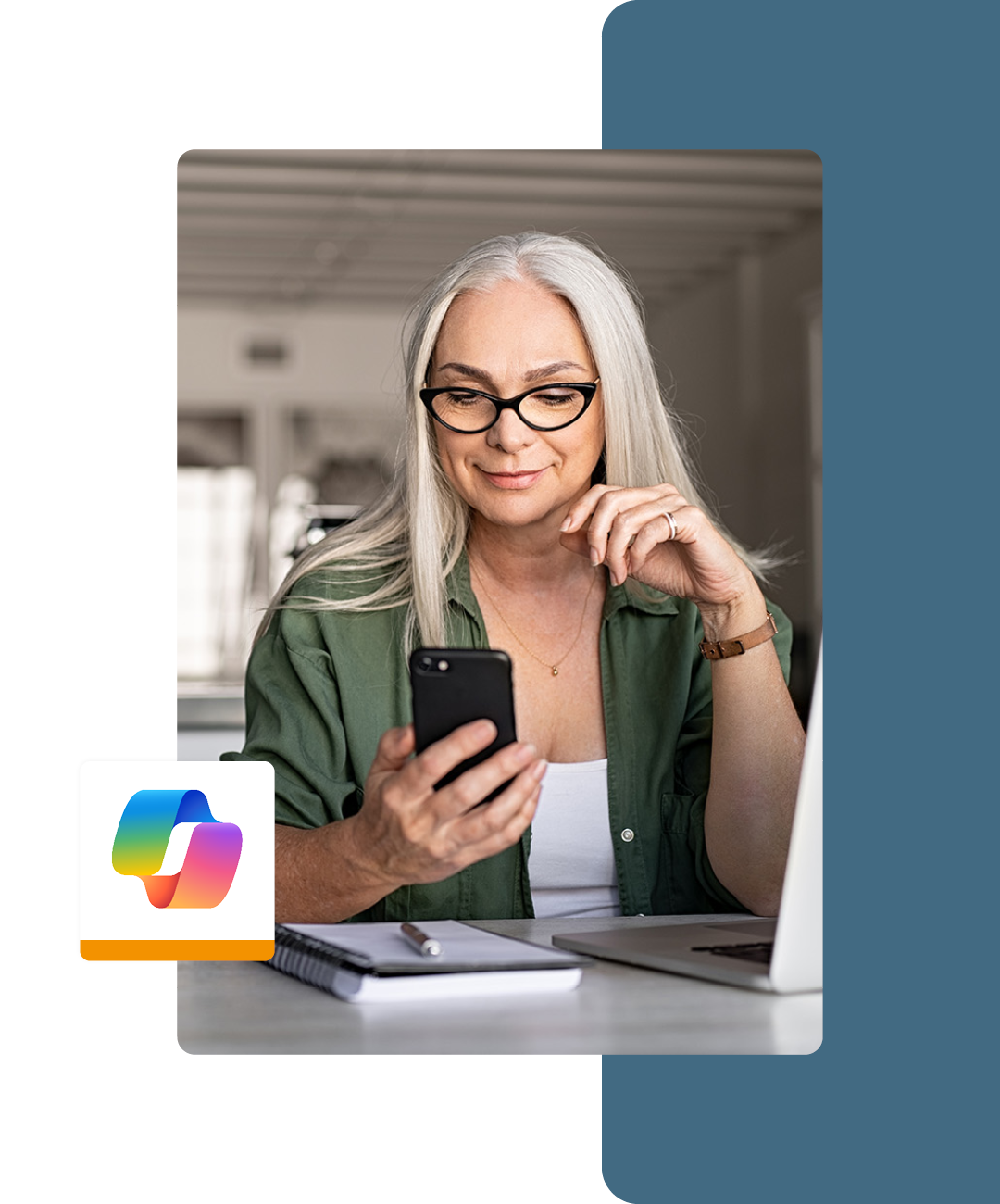 Image of a smiling working professional working on a laptop