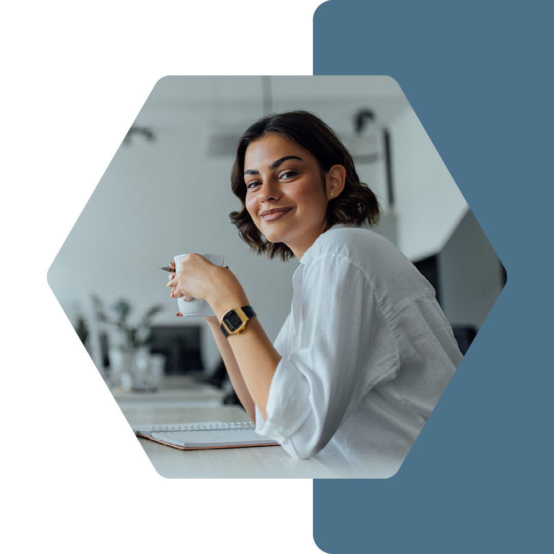 Image of a person sat at a work desk