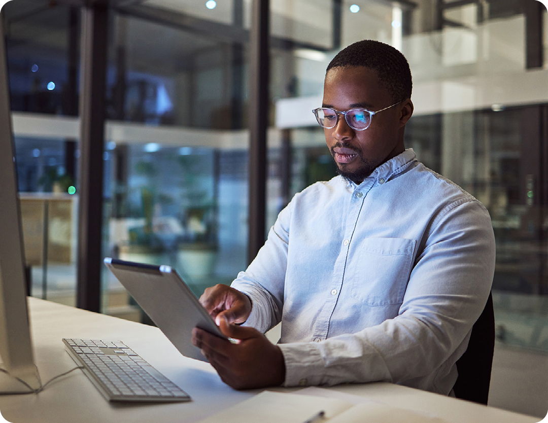 Image of an IT professional working on a tablet