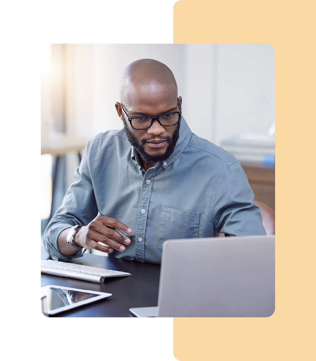 Image of an IT professional working on a laptop