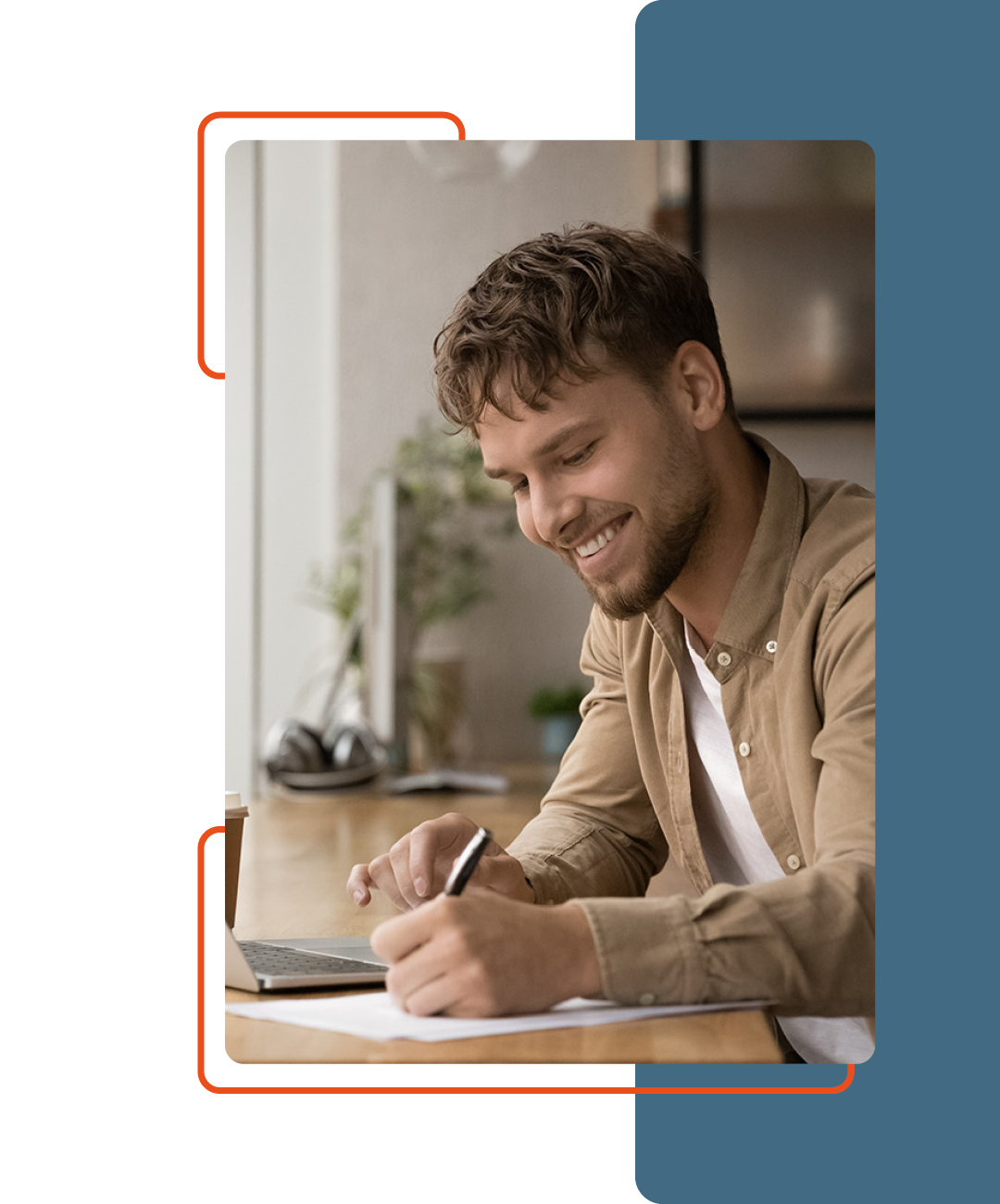 Image of a person smiling while working at their desk