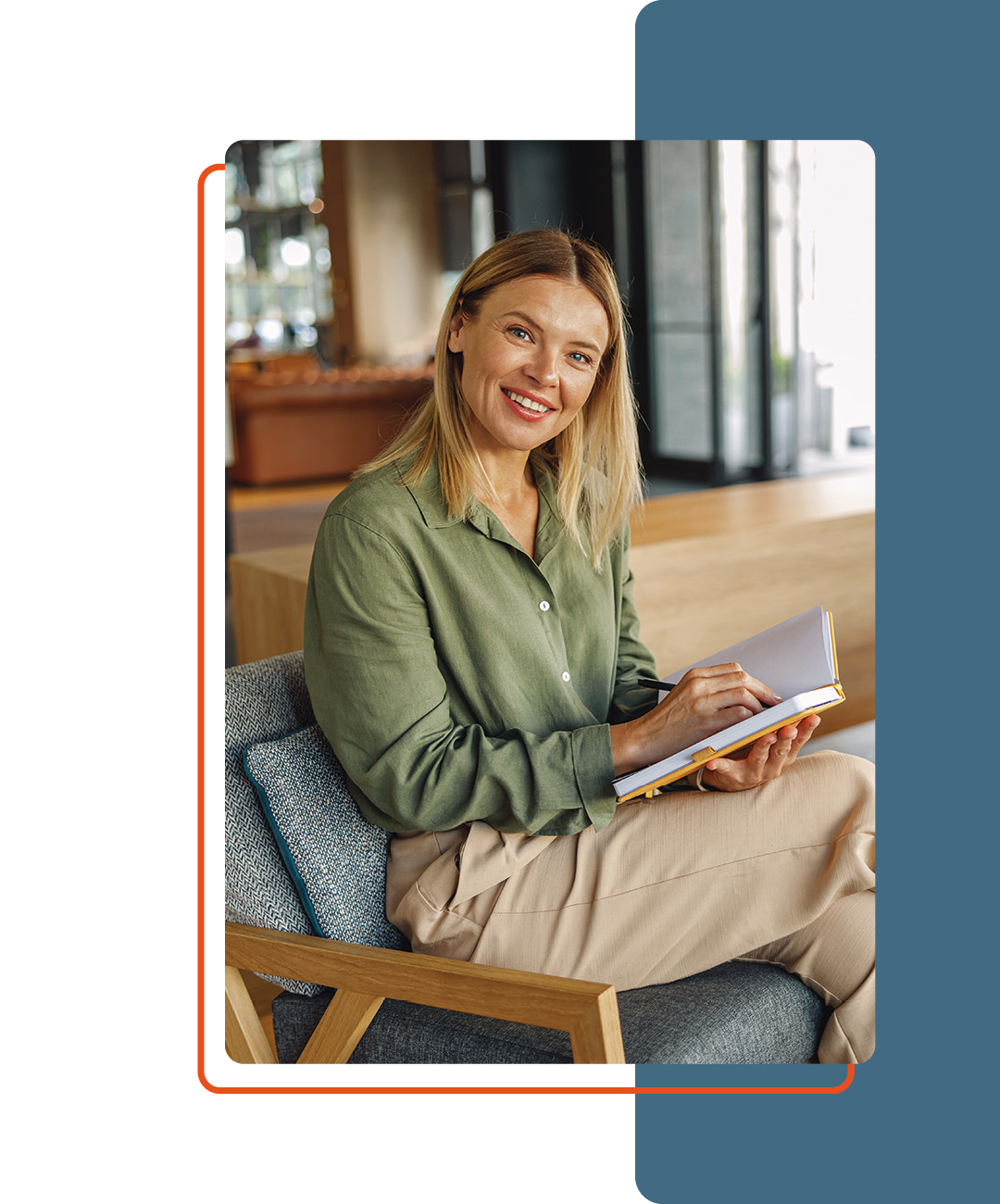 Image of a person sat on a seat with a book in their hand