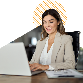 Image of a person working on a laptop at a desk