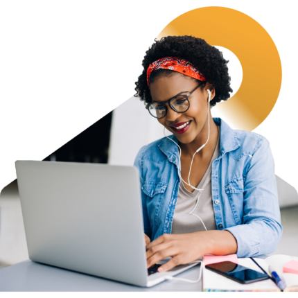 Image of a smiling person working on a laptop