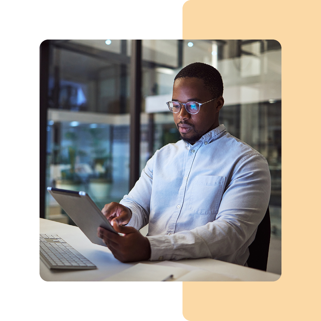 Image of an IT security professional working on a tablet