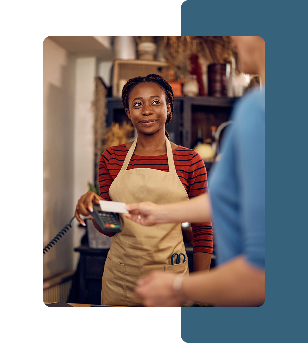 Image of a person paying on a card reader using a credit card