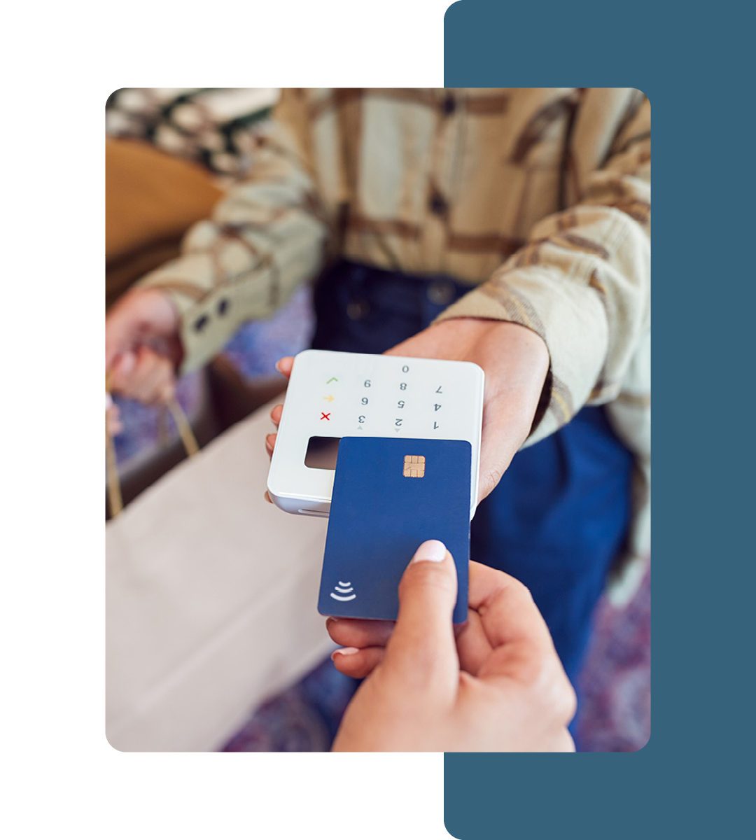 Image of a person paying on a card reader using a credit card