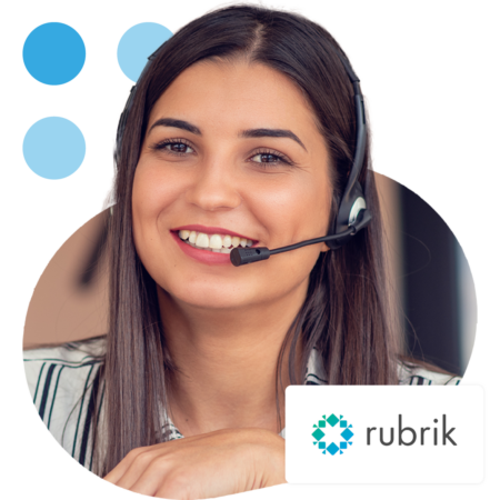 Image of an IT support professional talking on a headset with the Rubrik logo