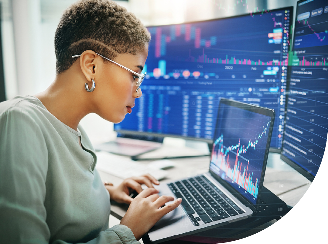 Image of a data analyst analysing data on a laptop